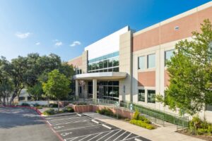 The Oaks III Class A office building in San Antonio featuring modern office space, professional business suites, landscaped grounds, and flexible commercial workspace.