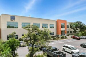 Inwood Village commercial office building in San Antonio featuring a two-story design, landscaped parking, and modern exterior architecture.