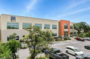 Inwood Village commercial office building in San Antonio featuring a two-story design, landscaped parking, and modern exterior architecture.