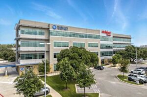 Ridgewood Plaza office building in north-central San Antonio featuring modern architecture, modern amenities, and on-site parking.